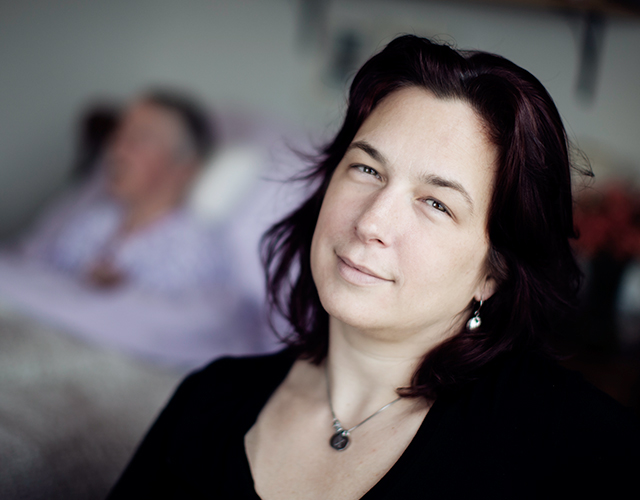 Catherine Ann sits next to her mother Isabel’s bedside in their Newfoundland and Labrador home, where Catherine Ann has been her mother’s primary caregiver since 2012.